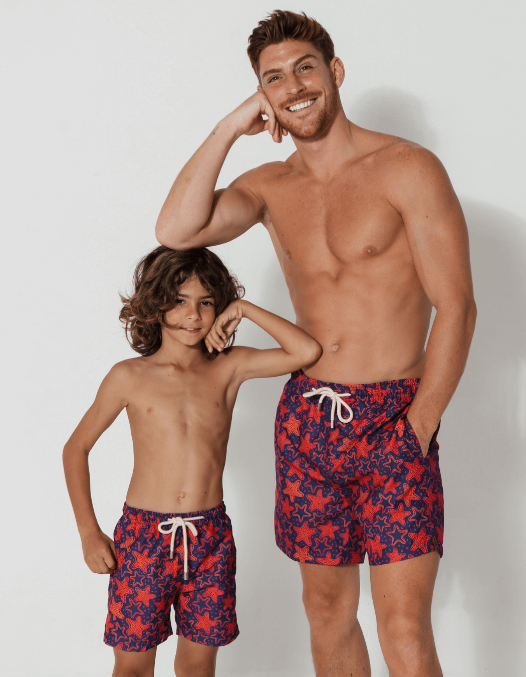 father and son swim shorts red starfish