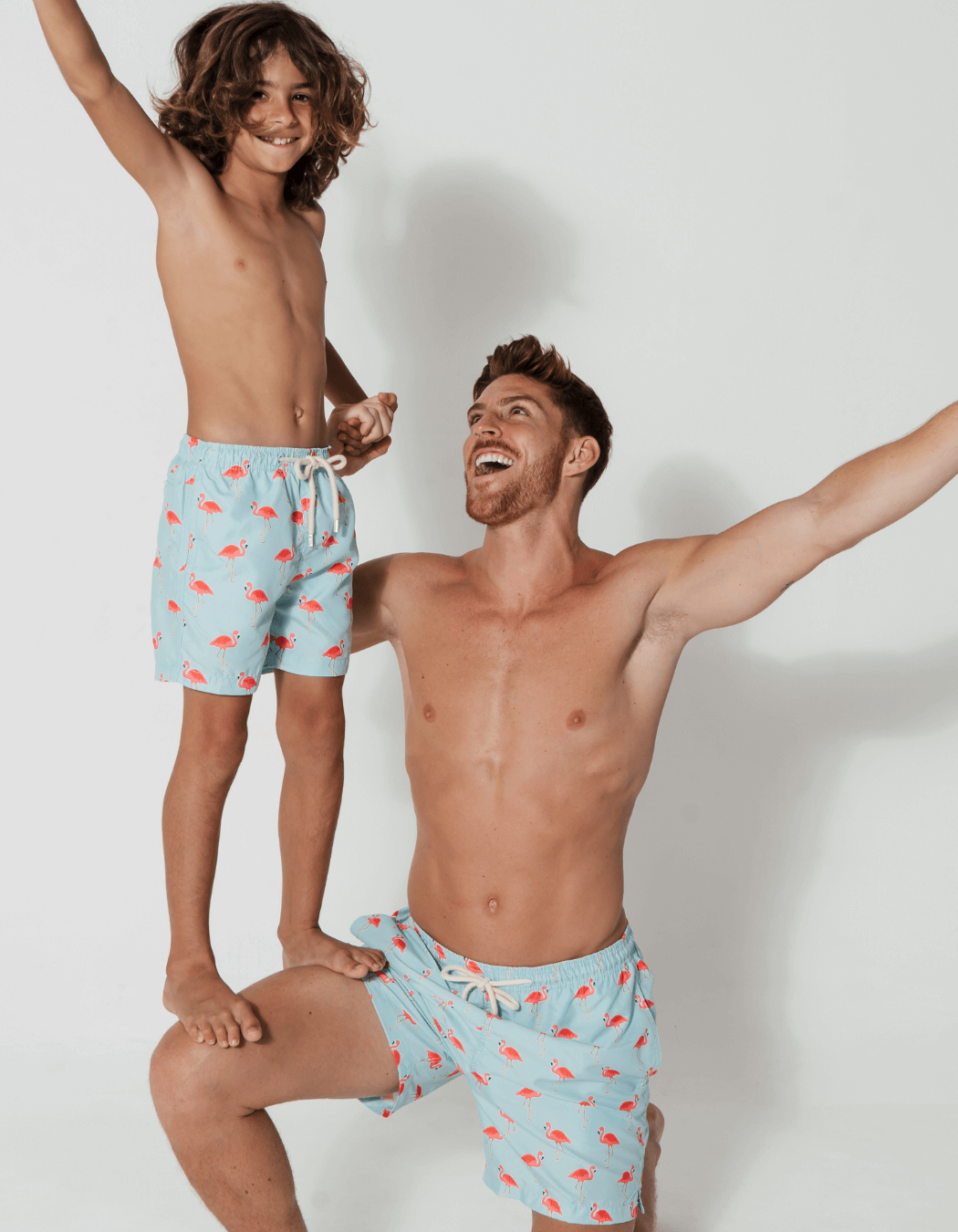 father and son swim shorts flamingo