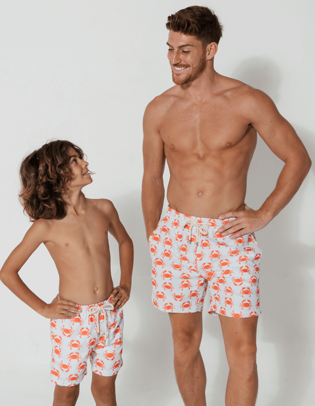 father and son swim shorts peach crab